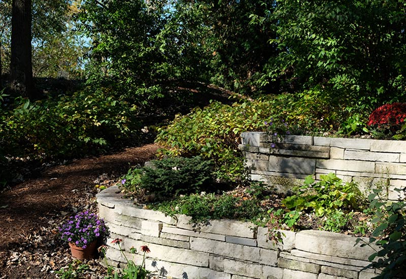 Quarry Project: backyard landscape design with stone wall