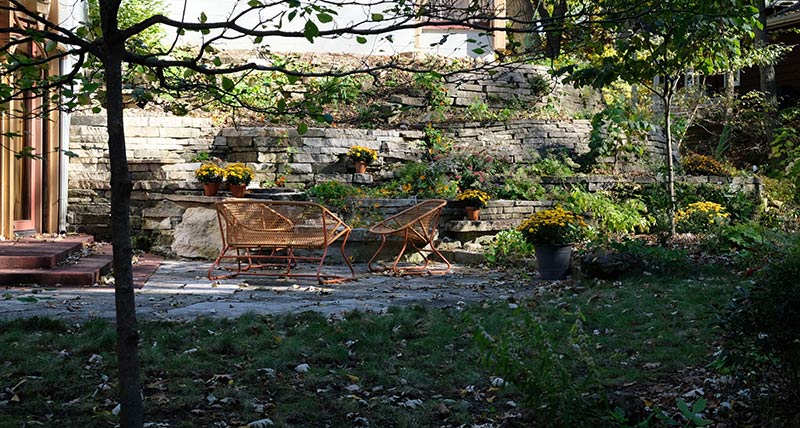 Quarry Project: Backyard landscape with seating in the shade.